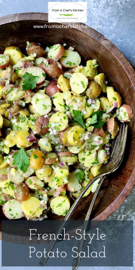 Pinterest graphic for French Potato Salad showing the salad in a dark wood bowl with serving utensils.