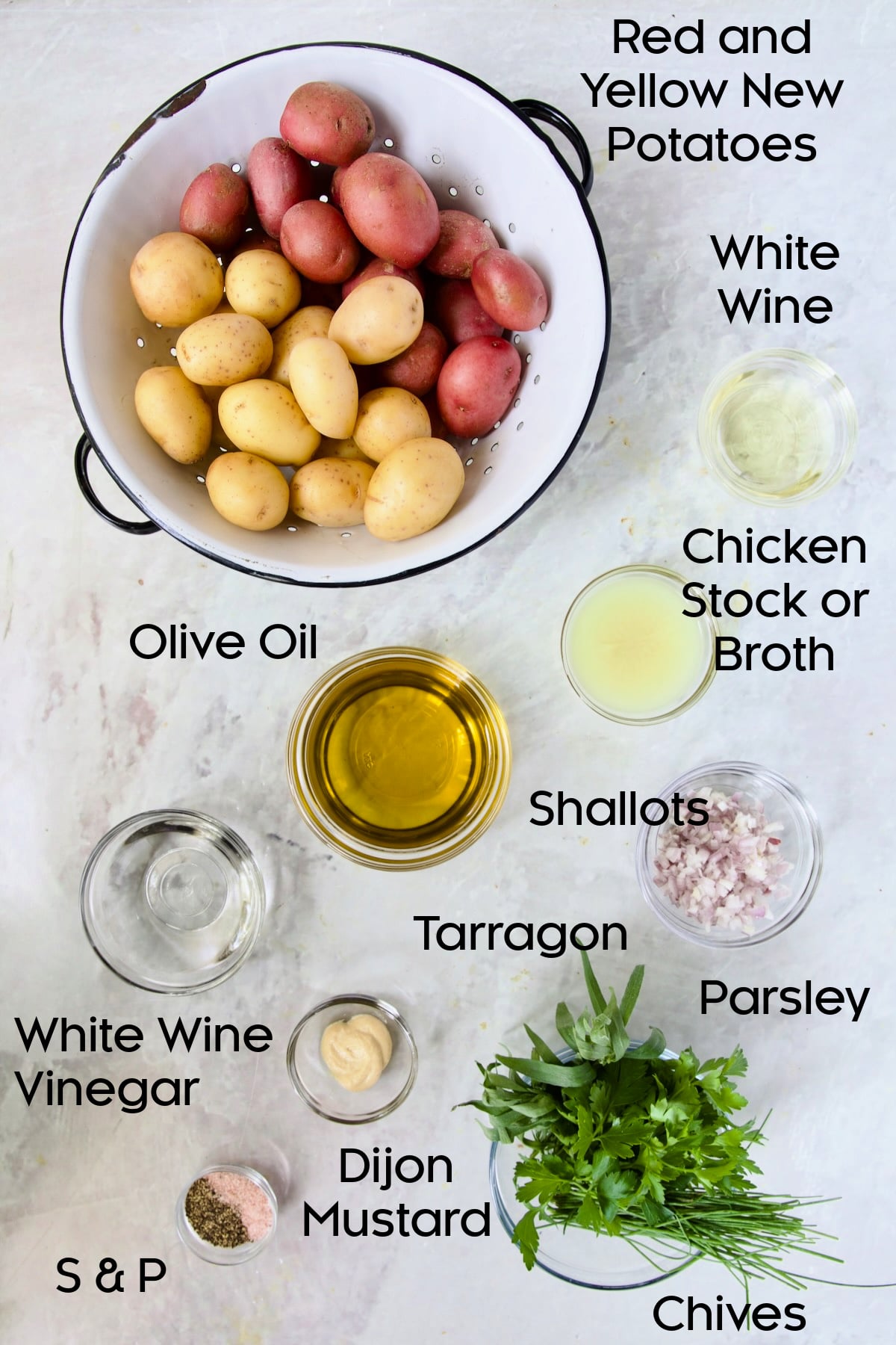 Ingredients for French Potato Salad in glass bowls.