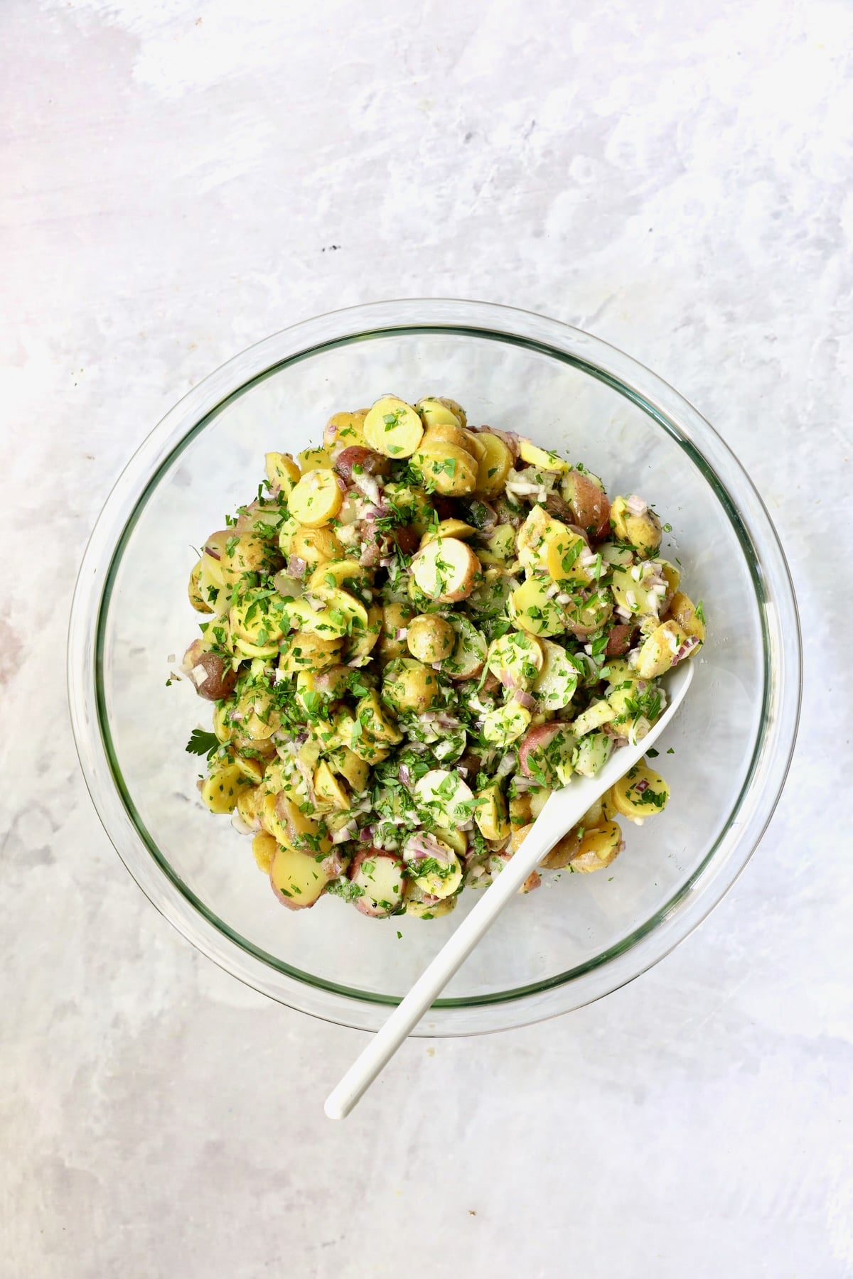 French Potato Salad in glass bowl.