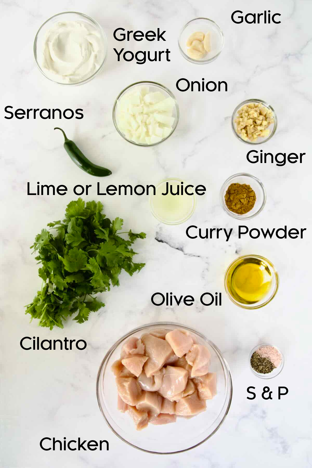 Ingredients for Yogurt Marinated Grilled Chicken Skewers in glass bowls.