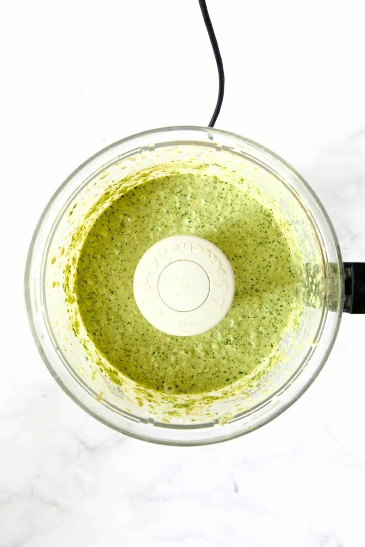 Yogurt marinade in food processor after being pureed.