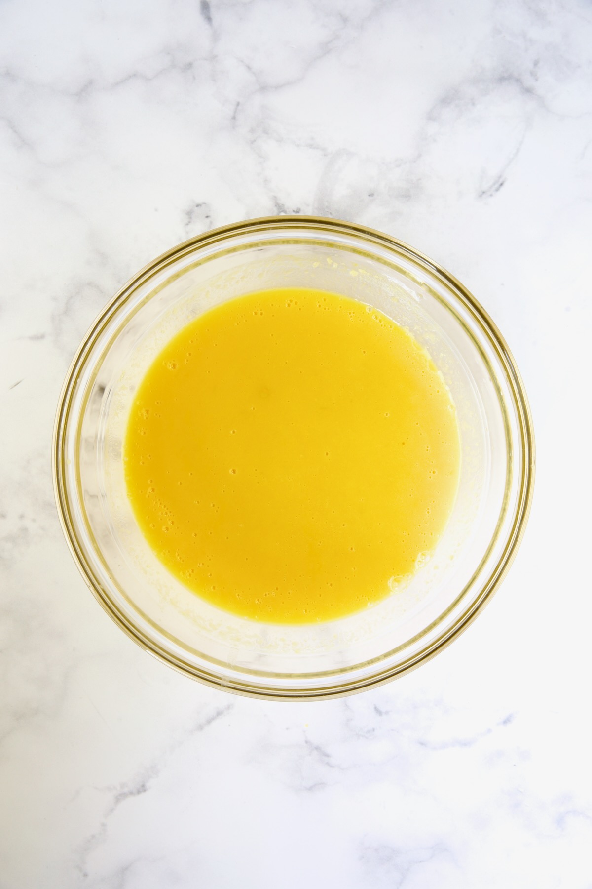 Mango puree in glass bowl.