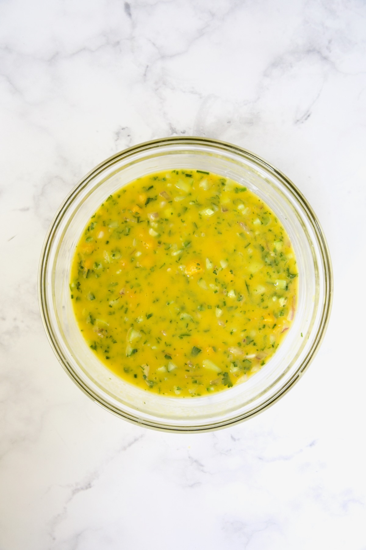 Mango Gazpacho in glass bowl.