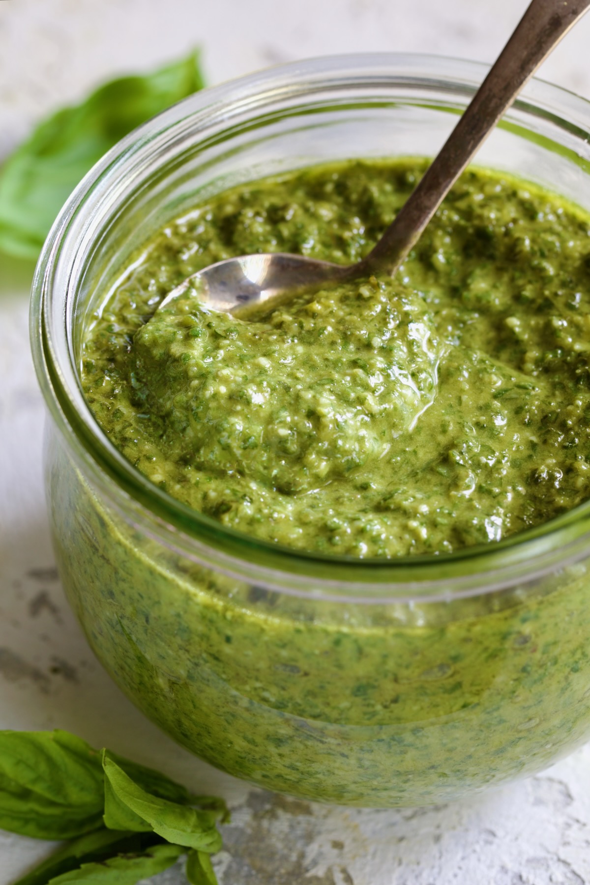 Jar of Pesto Genovese with spoon.