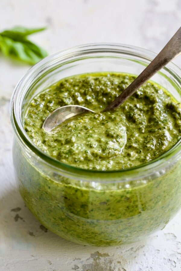 Jar of Pesto Genovese with spoon.