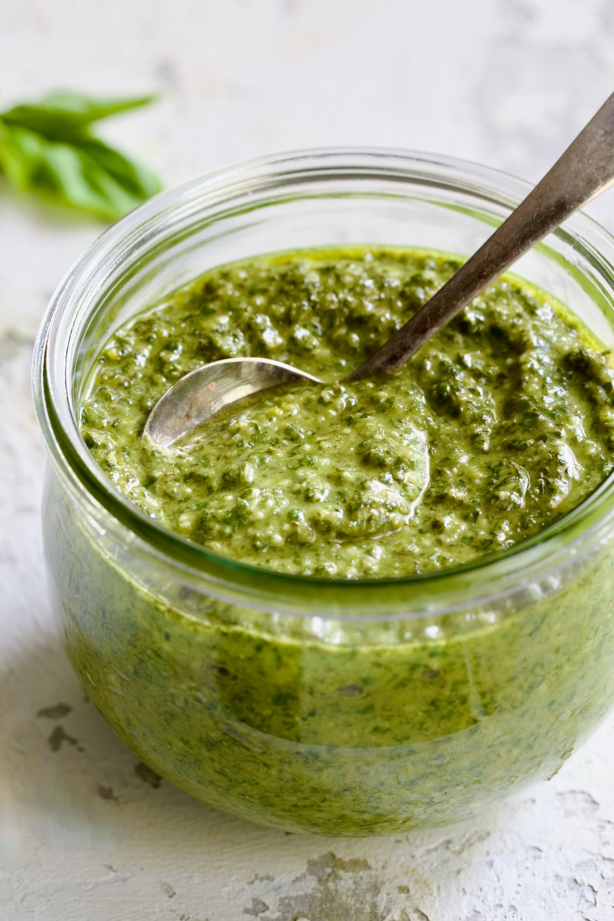 Jar of Pesto Genovese with spoon.