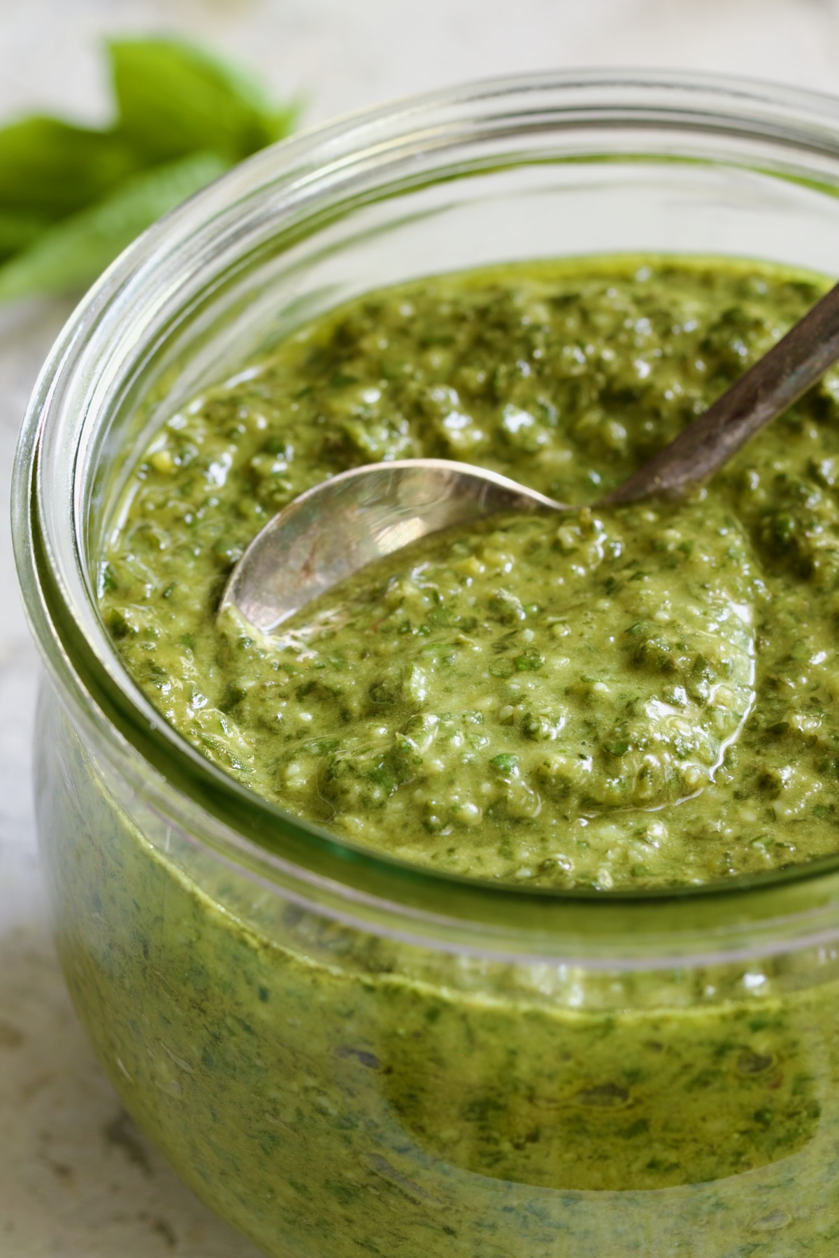 Jar of Pesto Genovese with spoon.