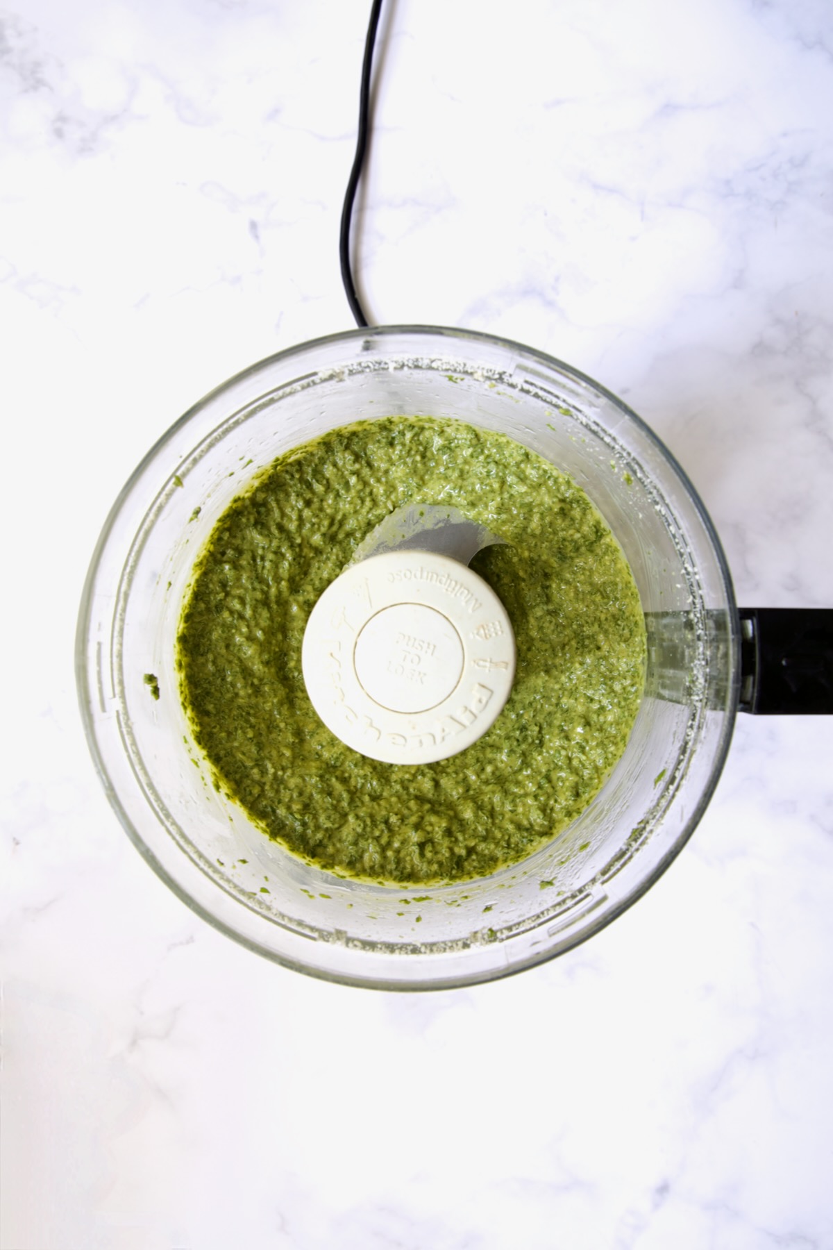 Finished pesto in food processor.