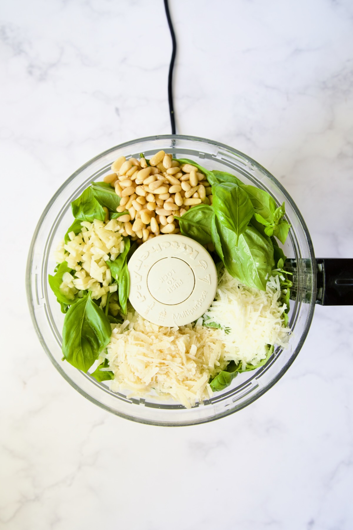 Ingredients for Pesto Genovese in food processor before being pureed.