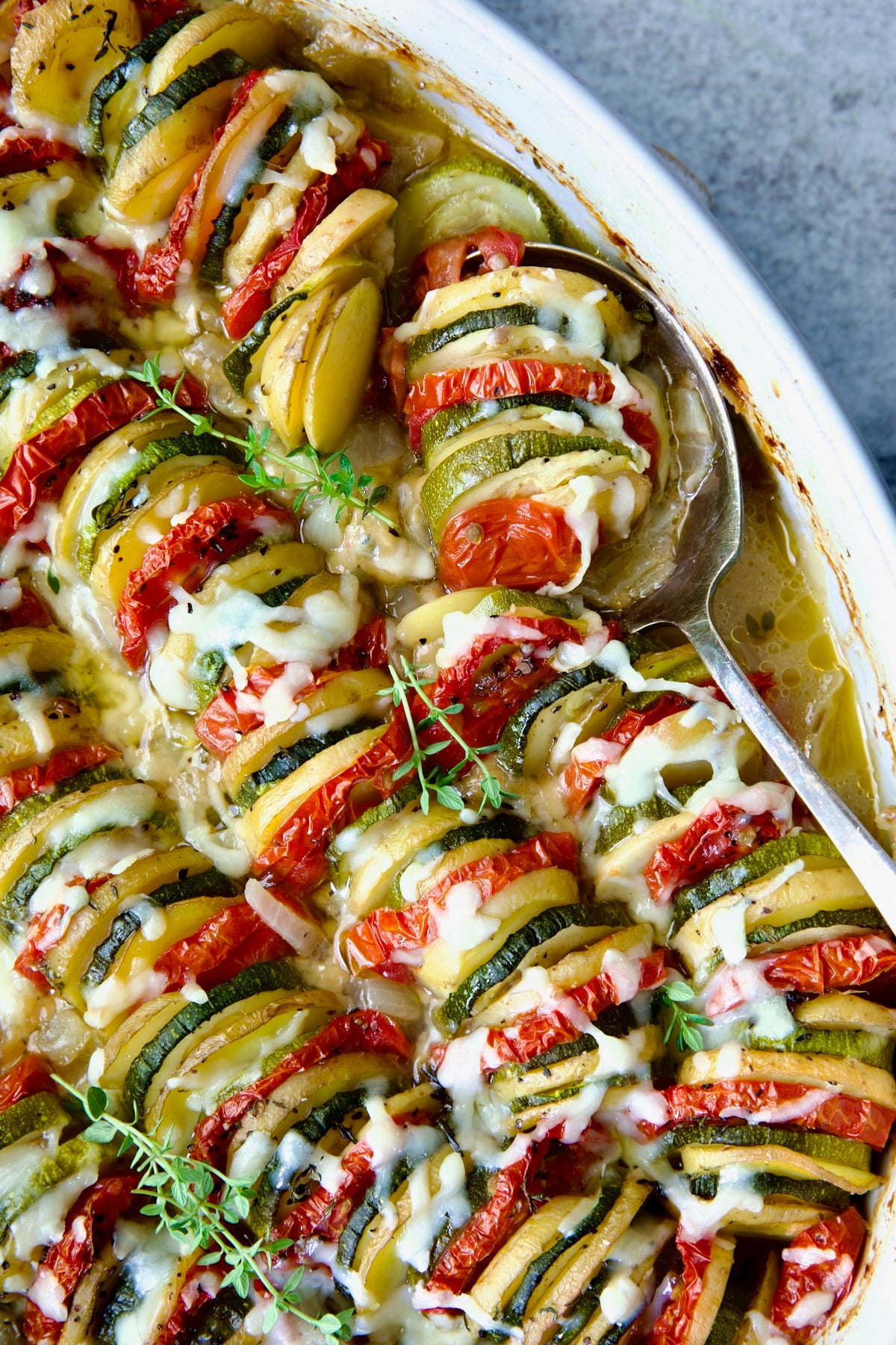 Vegetable Tian with serving spoon.