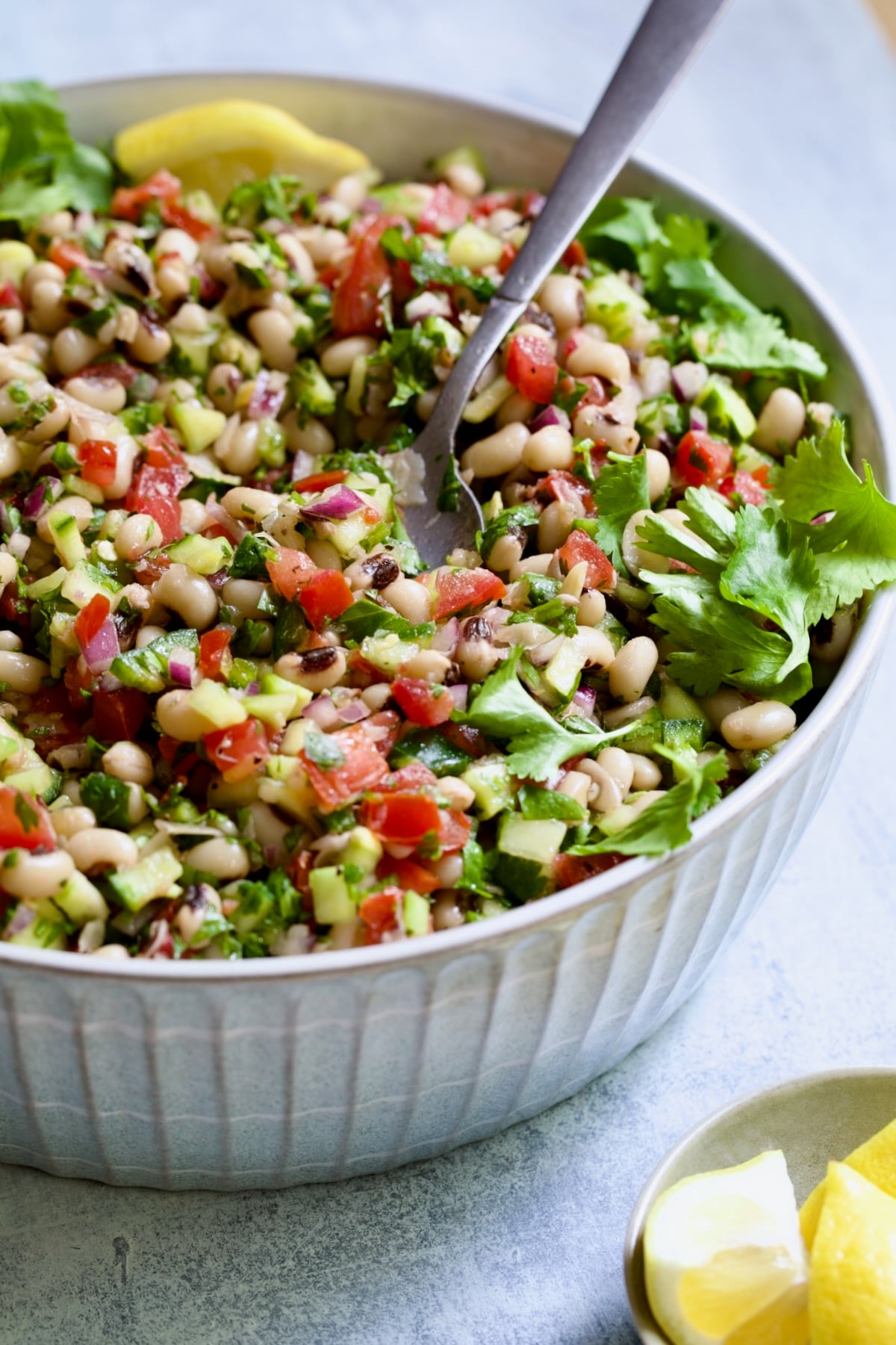 Black-Eyed Pea Salad in serving bowl with serving spoon.