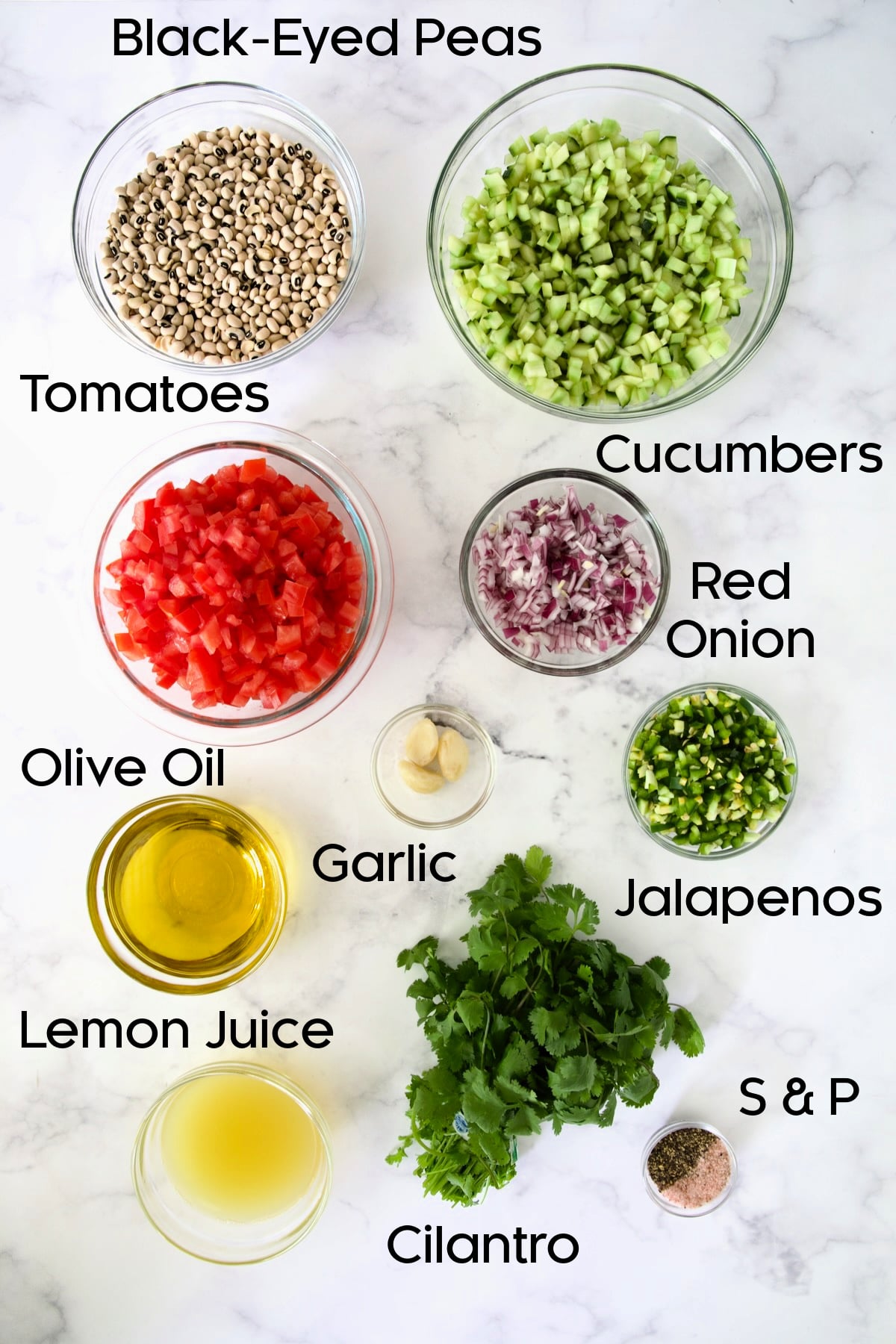 Ingredients for Black-Eyed Pea Salad in glass bowls.