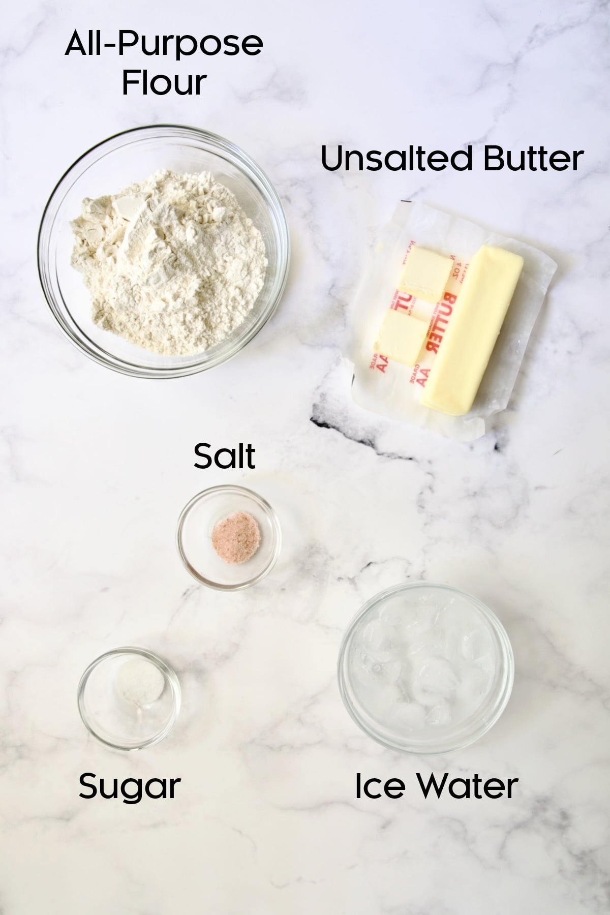 Ingredients for crust for Tomato Tart with Ricotta and Basil in glass bowls.