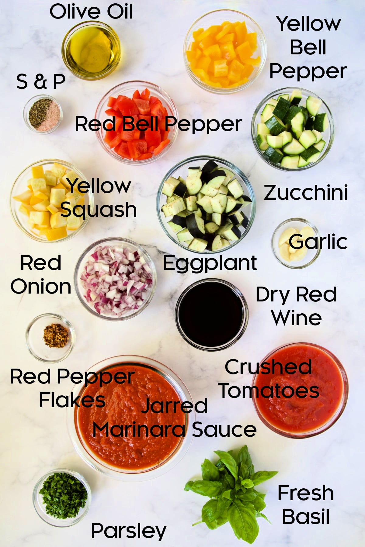 Prepped ingredients for Veggie Pasta Sauce in glass bowls.