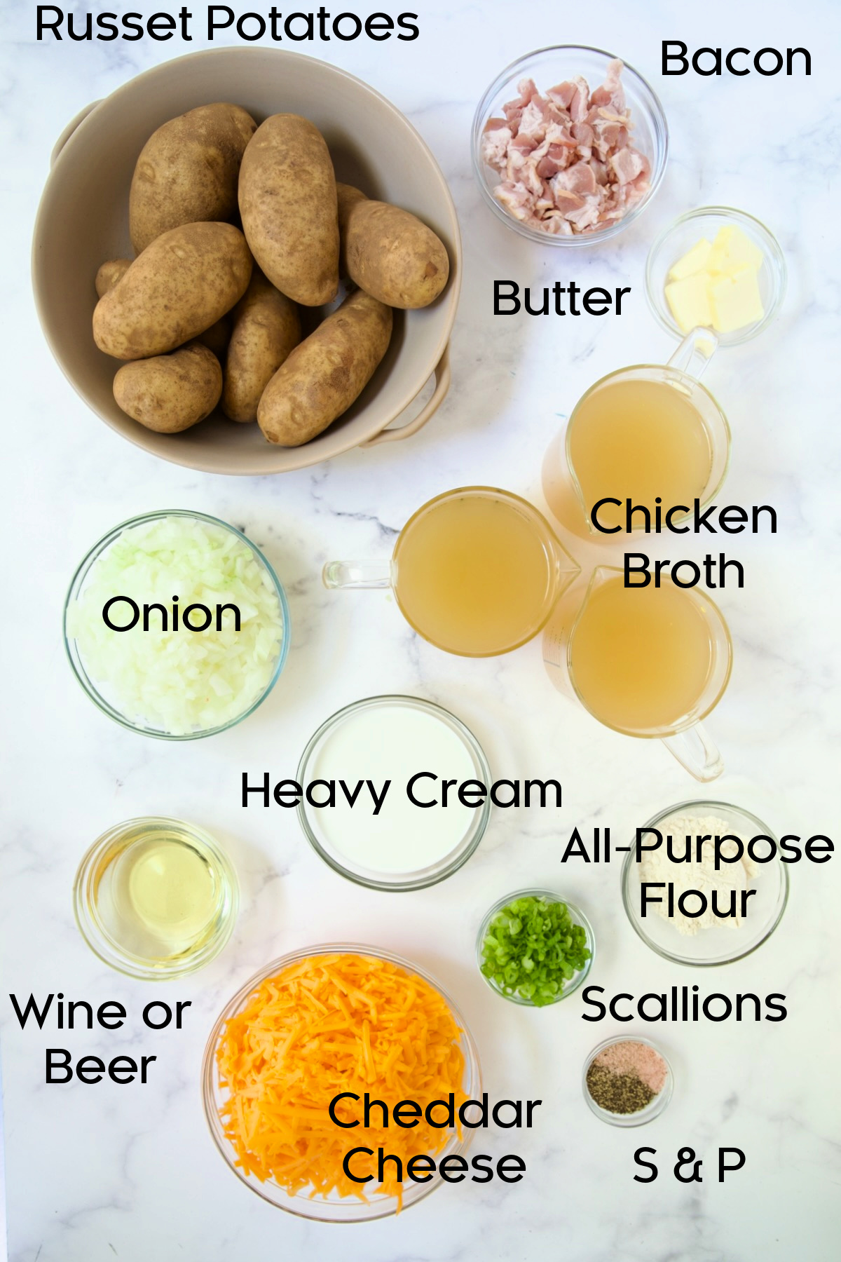 Ingredients for Cheddar Bacon Potato Soup in glass bowls.