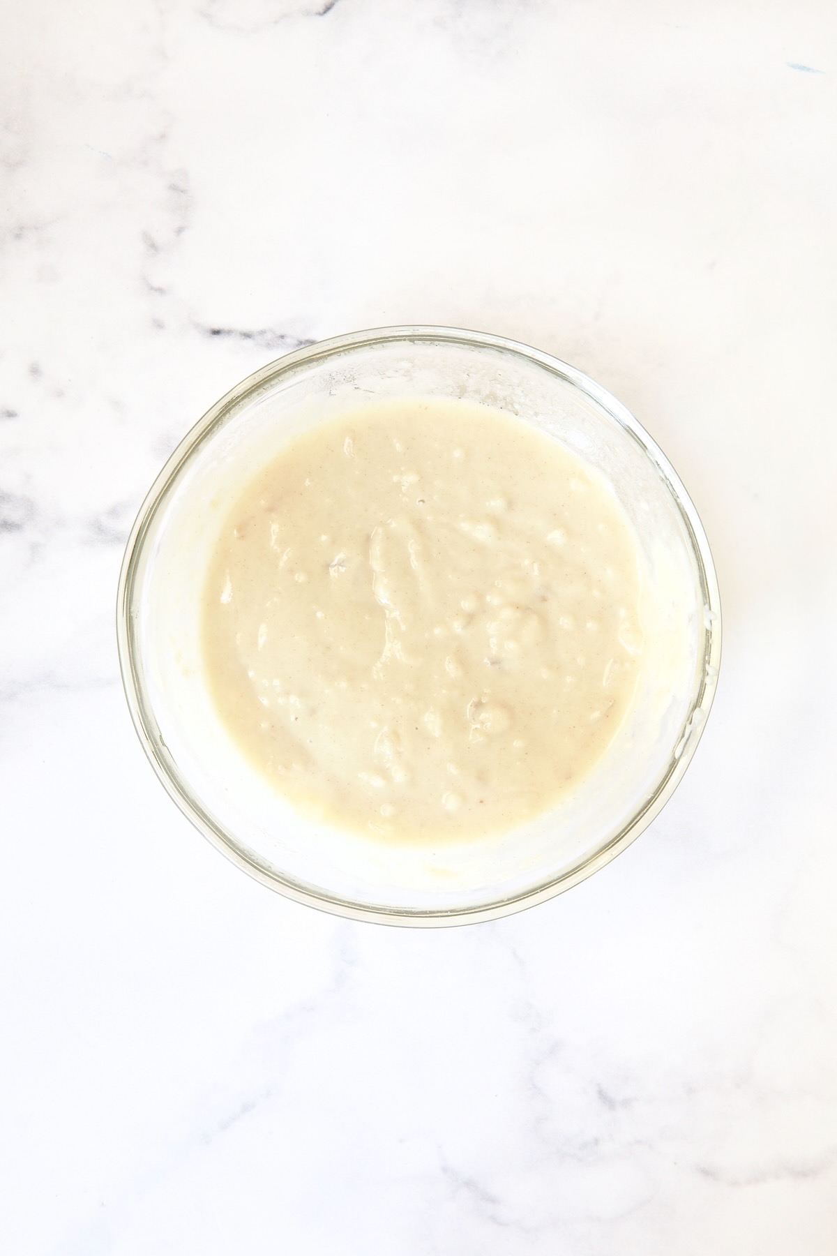 Glass bowl with flour slurry.