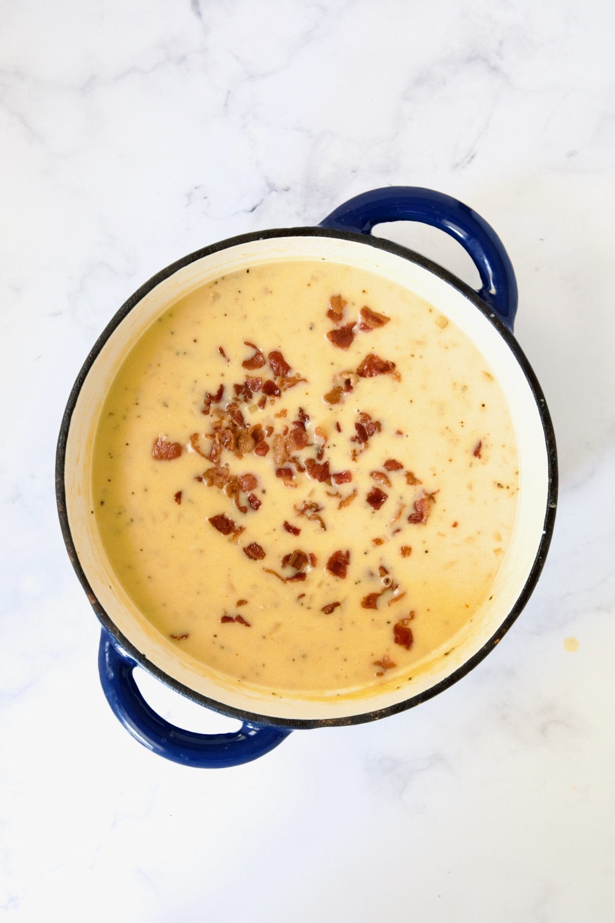 Cheddar Bacon Potato Soup with bacon sprinkled over the top.