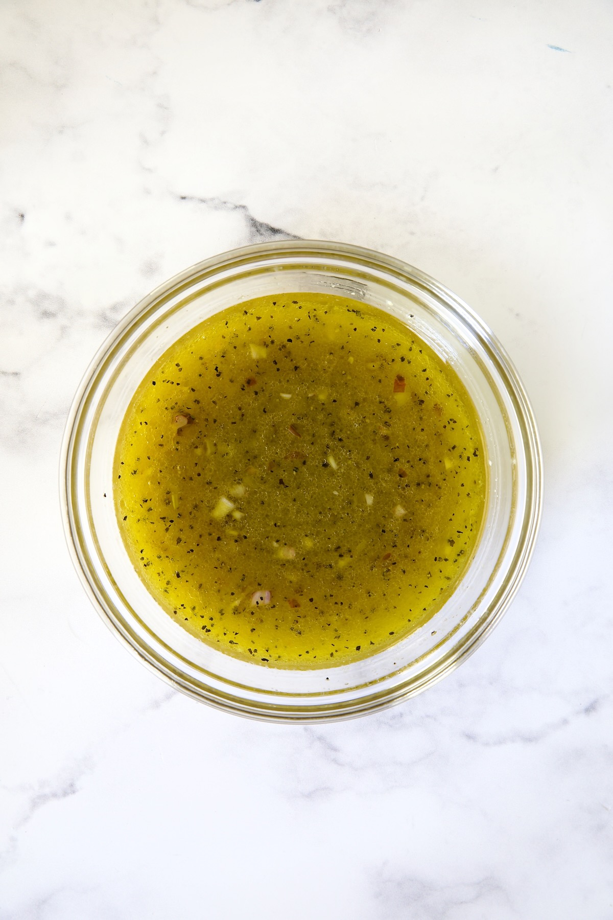 Dressing for Shaved Brussels Sprouts Salad in glass bowl.