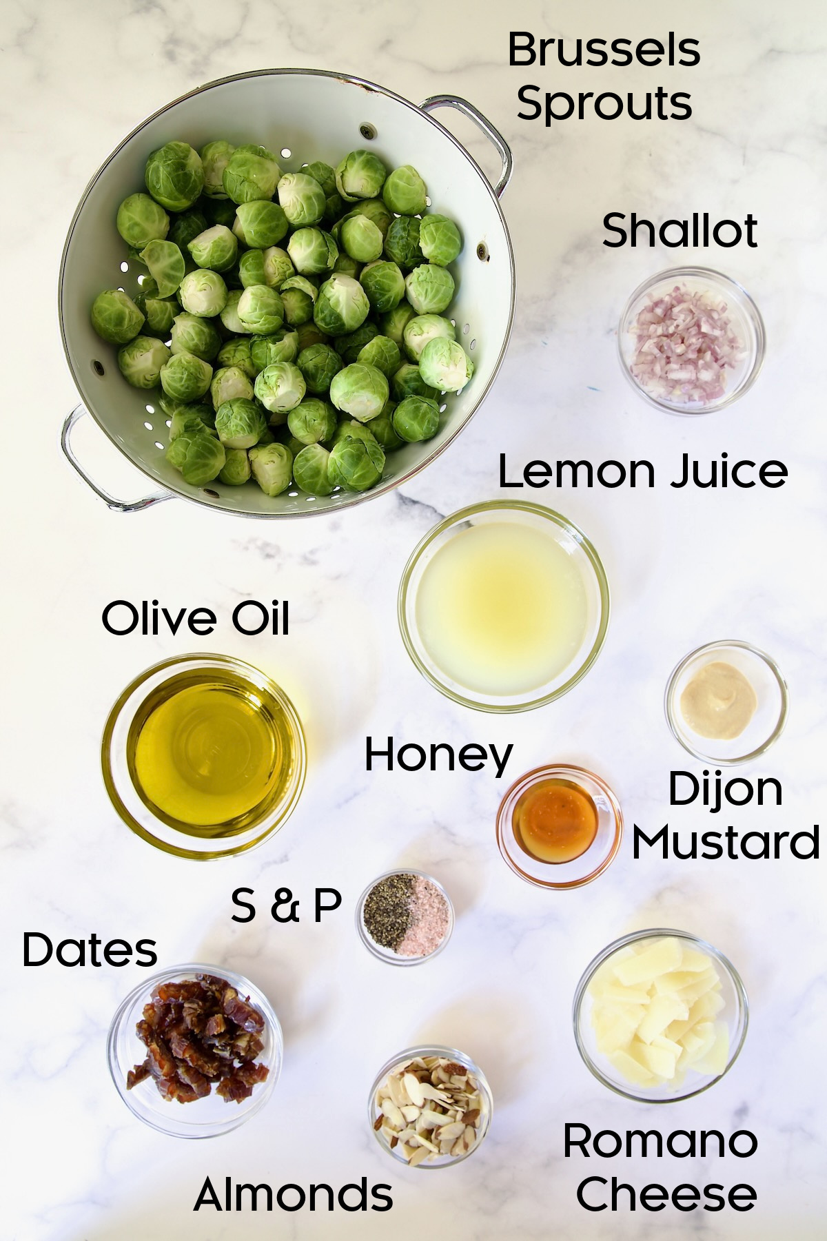 Ingredients for Shaved Brussels Sprouts Salad in separate glass bowls.