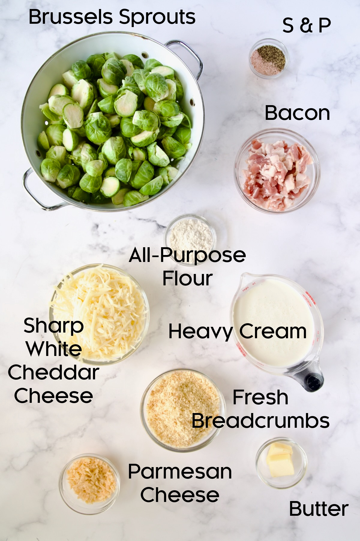 Ingredients for Brussels Sprouts Gratin in glass bowls.