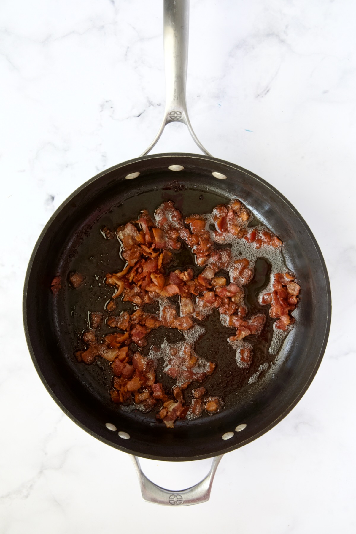 Cooked crispy bacon in nonstick skillet.
