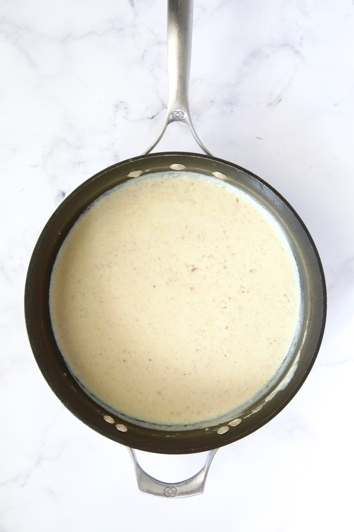 Creamy sauce in nonstick skillet.