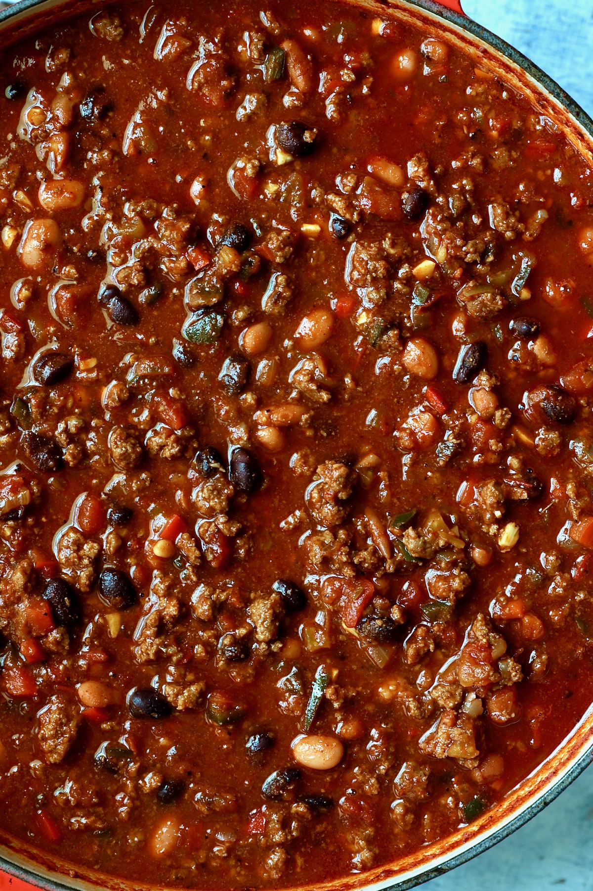 Finished chili in red Dutch oven.