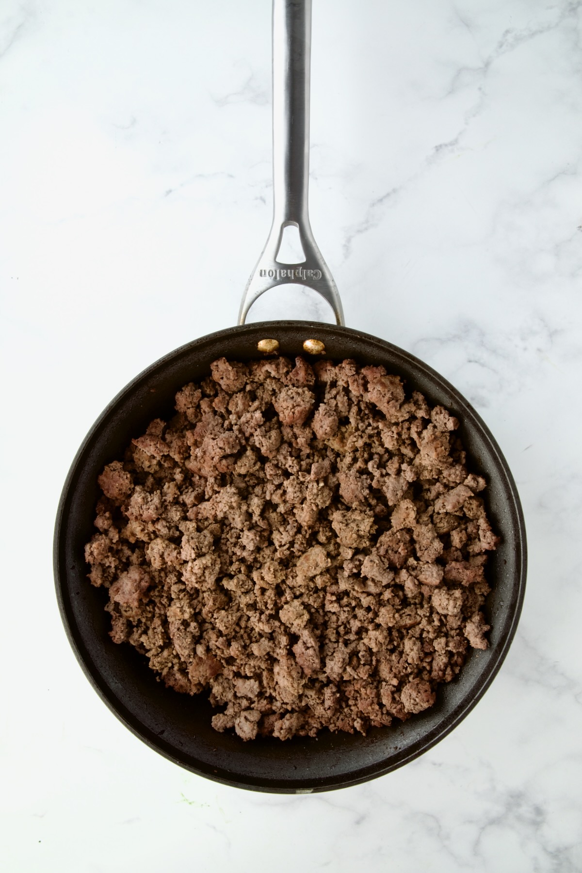 Browned ground beef in nonstick skillet.