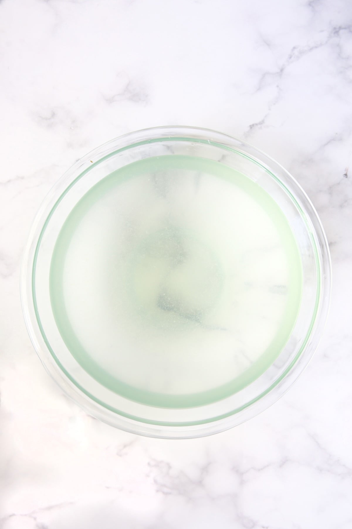 Lemon water in glass bowl.