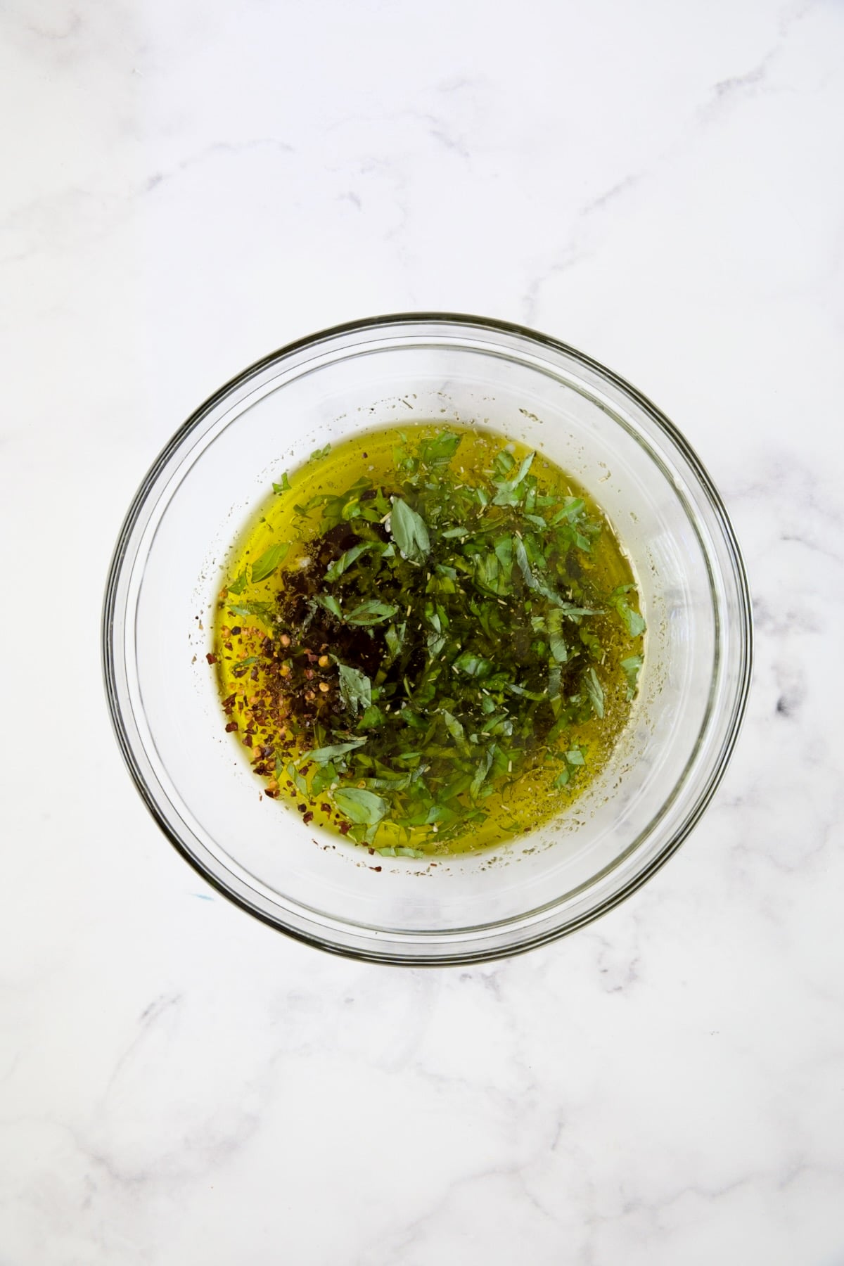 Marinade for Mozzarella Balls in glass bowl.