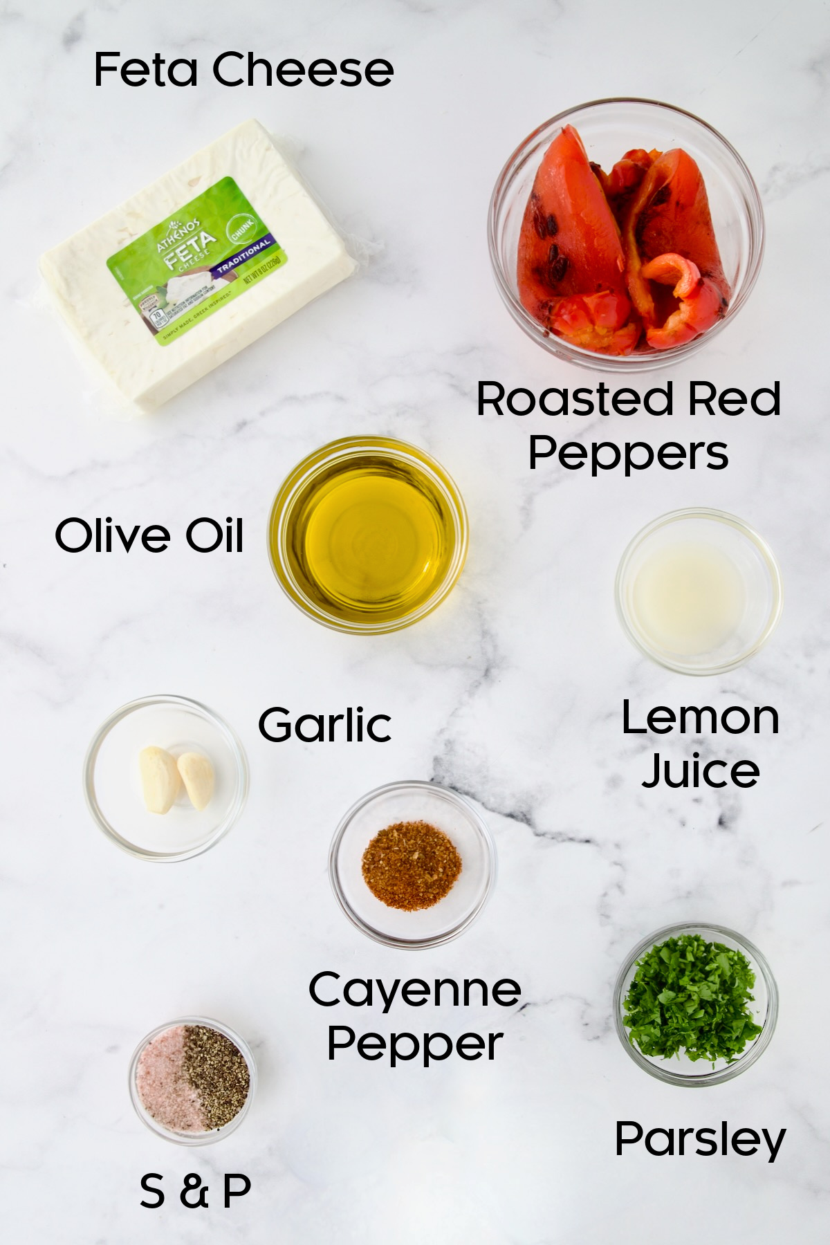 Ingredients for Spicy Feta Dip (Tirokafteri) in glass bowls.
