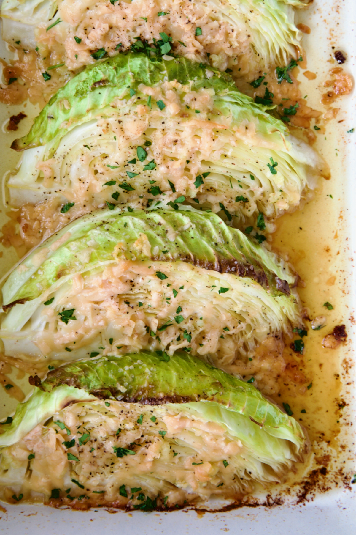 Three wedges of Baked Garlic Parmesan Cabbage Wedges.