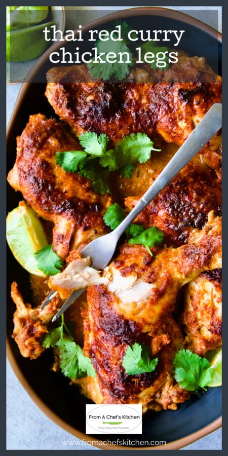Thai Red Curry Chicken Legs on black platter with serving fork.