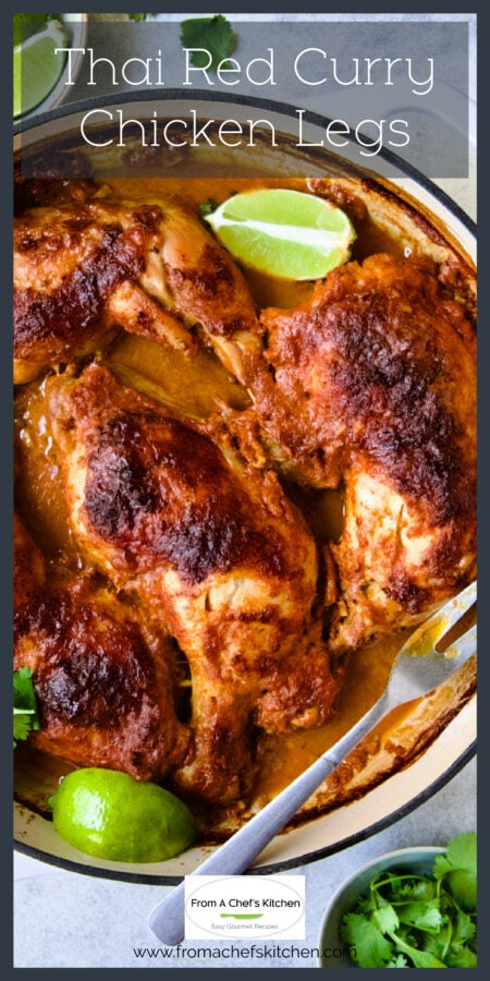 Thai Red Curry Chicken Legs in white enamel cast iron skillet with lime wedges.