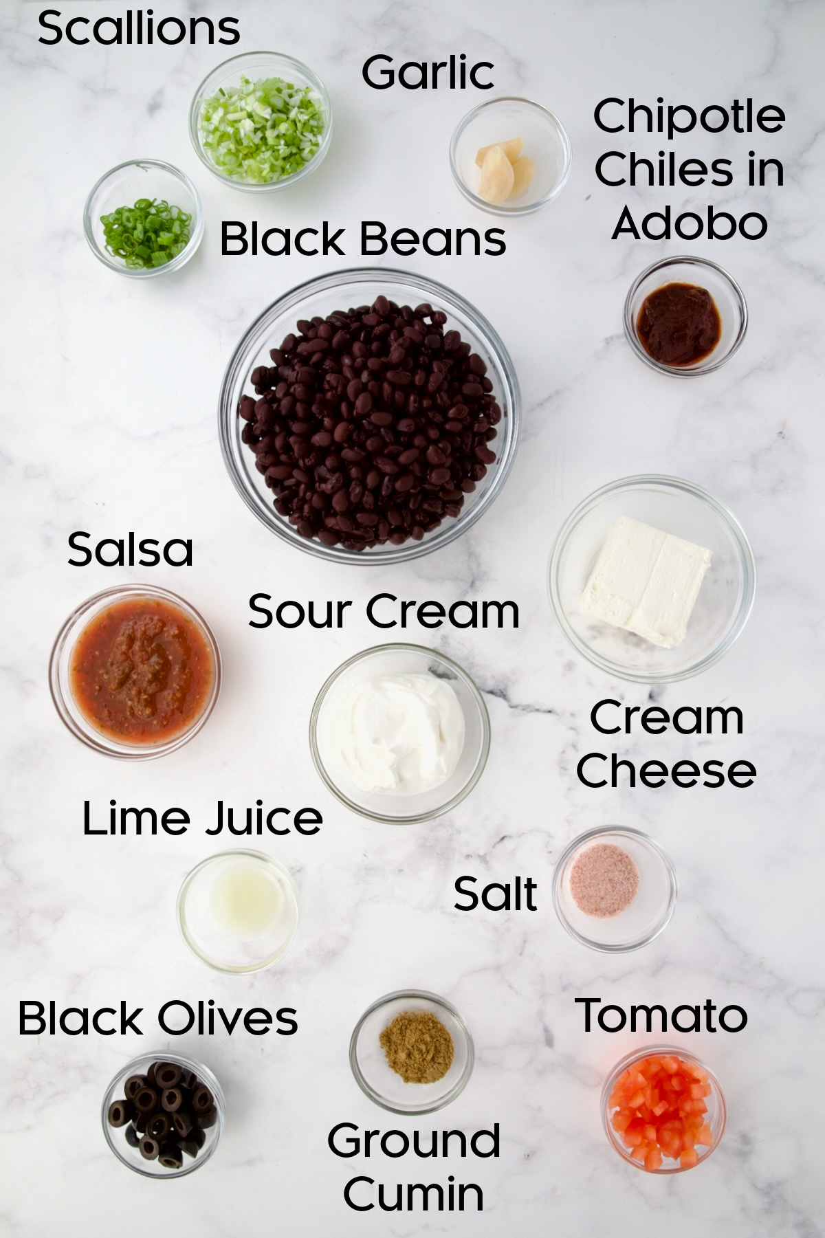 Ingredients for Black Bean Dip in glass bowls.