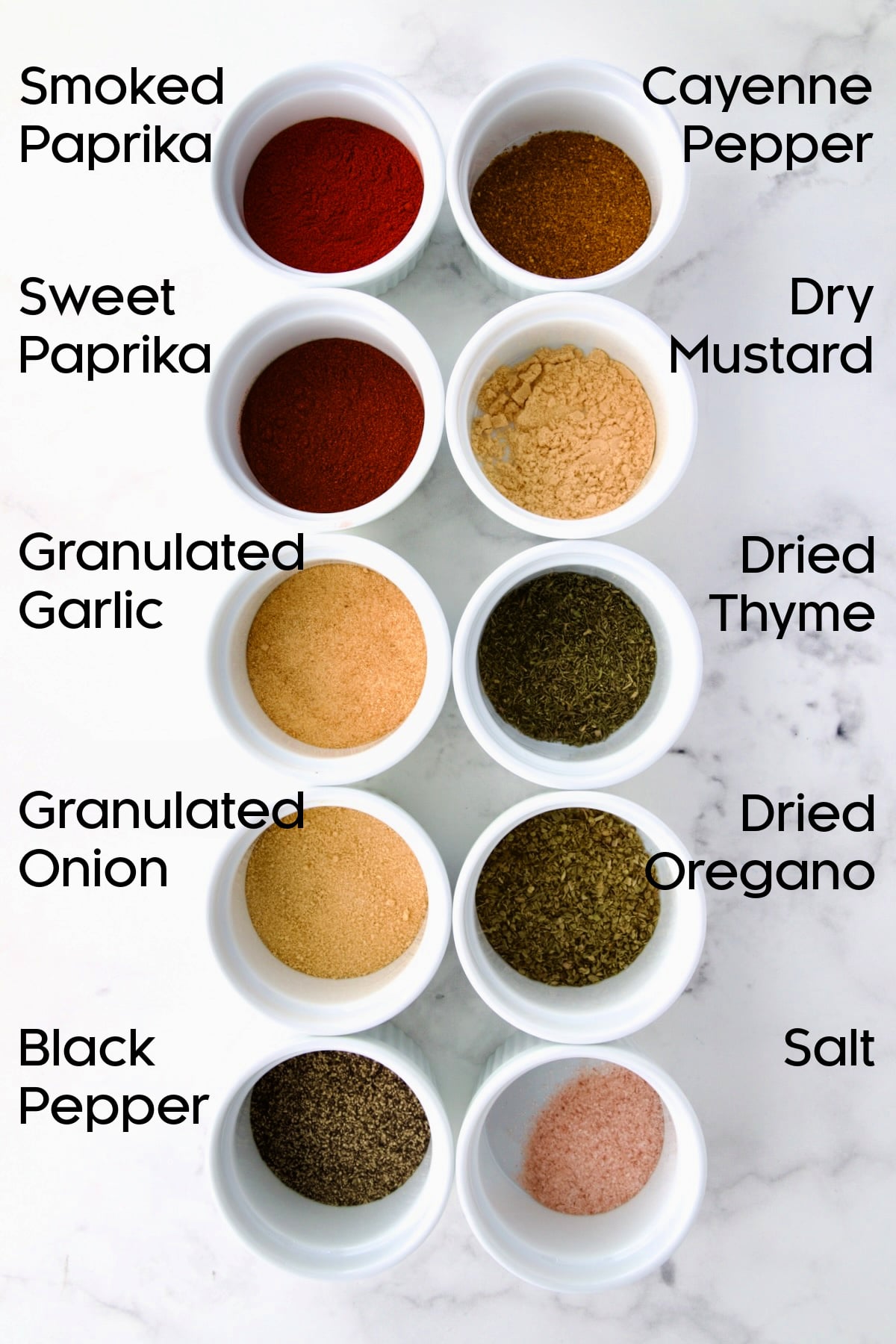 Ingredients for Blackening Seasoning in white ramekins.