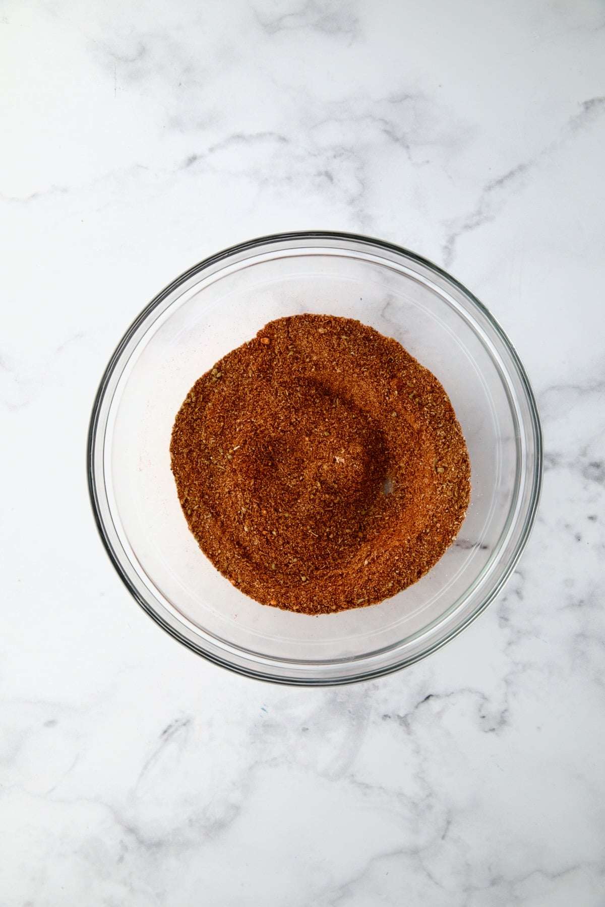Blackening Seasoning ingredients in glass bowl after being mixed together.