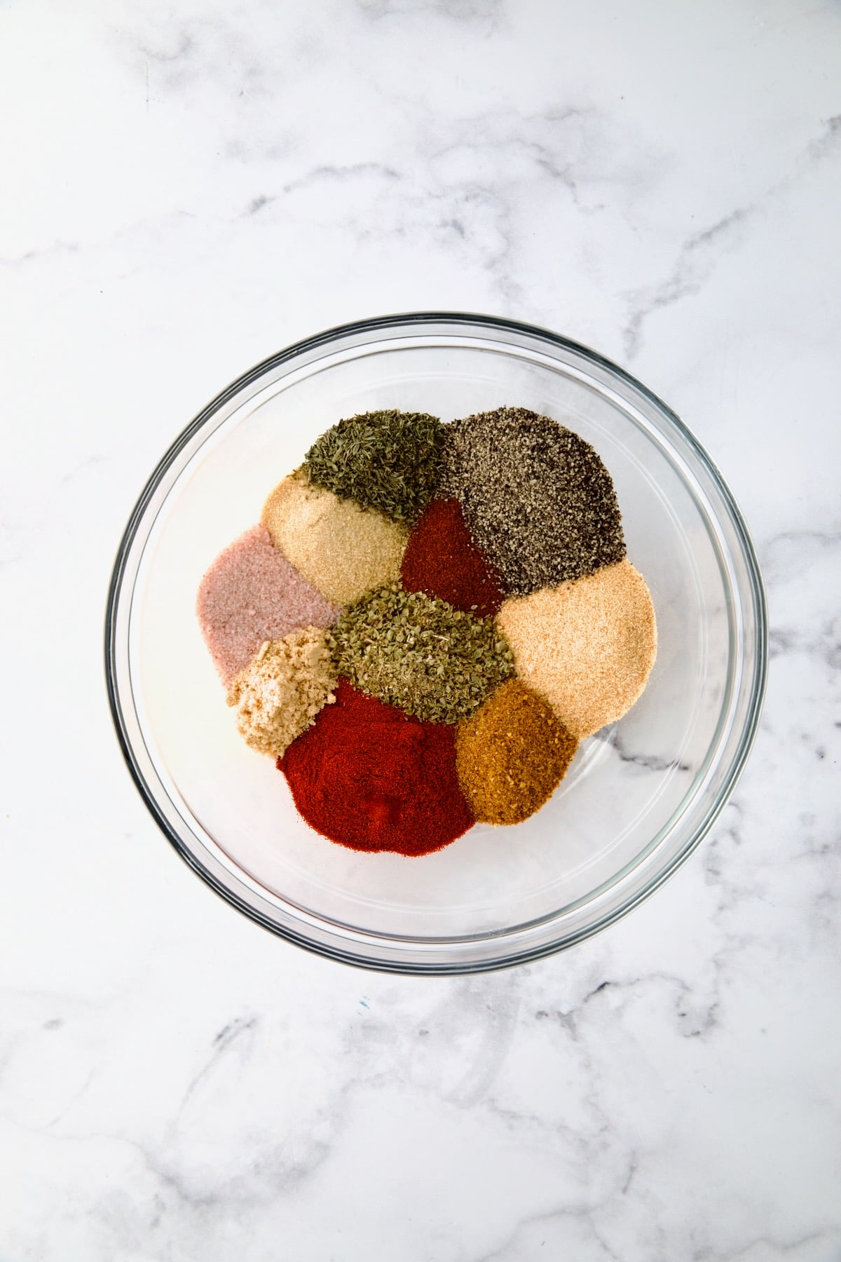 Blackening Seasoning ingredients in glass bowl before being mixed together.
