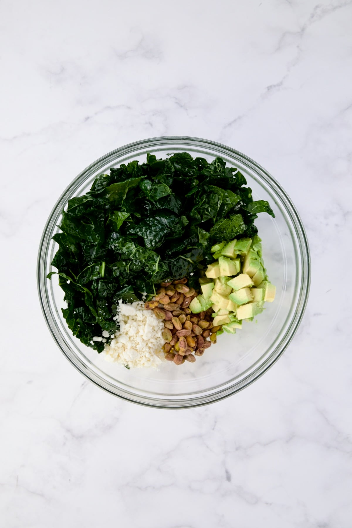 Ingredients for Tuscan Kale Salad in glass bowl.