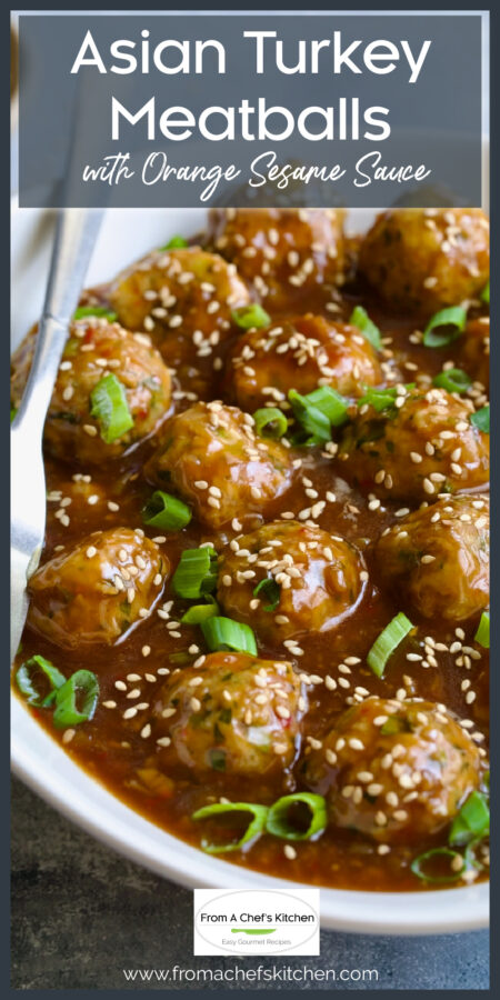 Asian Turkey Meatballs in oval white serving dish witih serving fork.