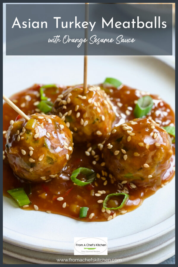Three Asian Turkey Meatballs on white appetizer plate with toothpicks inserted.