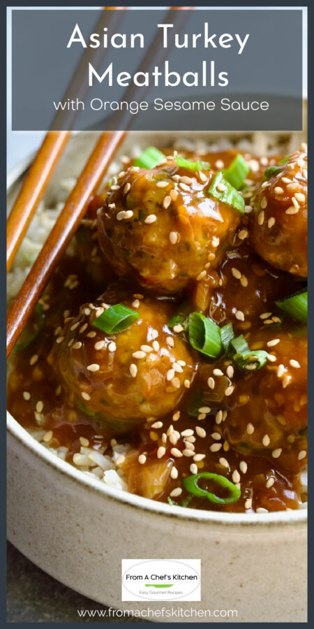 Asian Turkey Meatballs garnished with sesame seeds and sliced scallions in earthenware bowl with chopsticks.