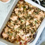 Reuben Casserole in white rectangular baking dish on cooling rack.