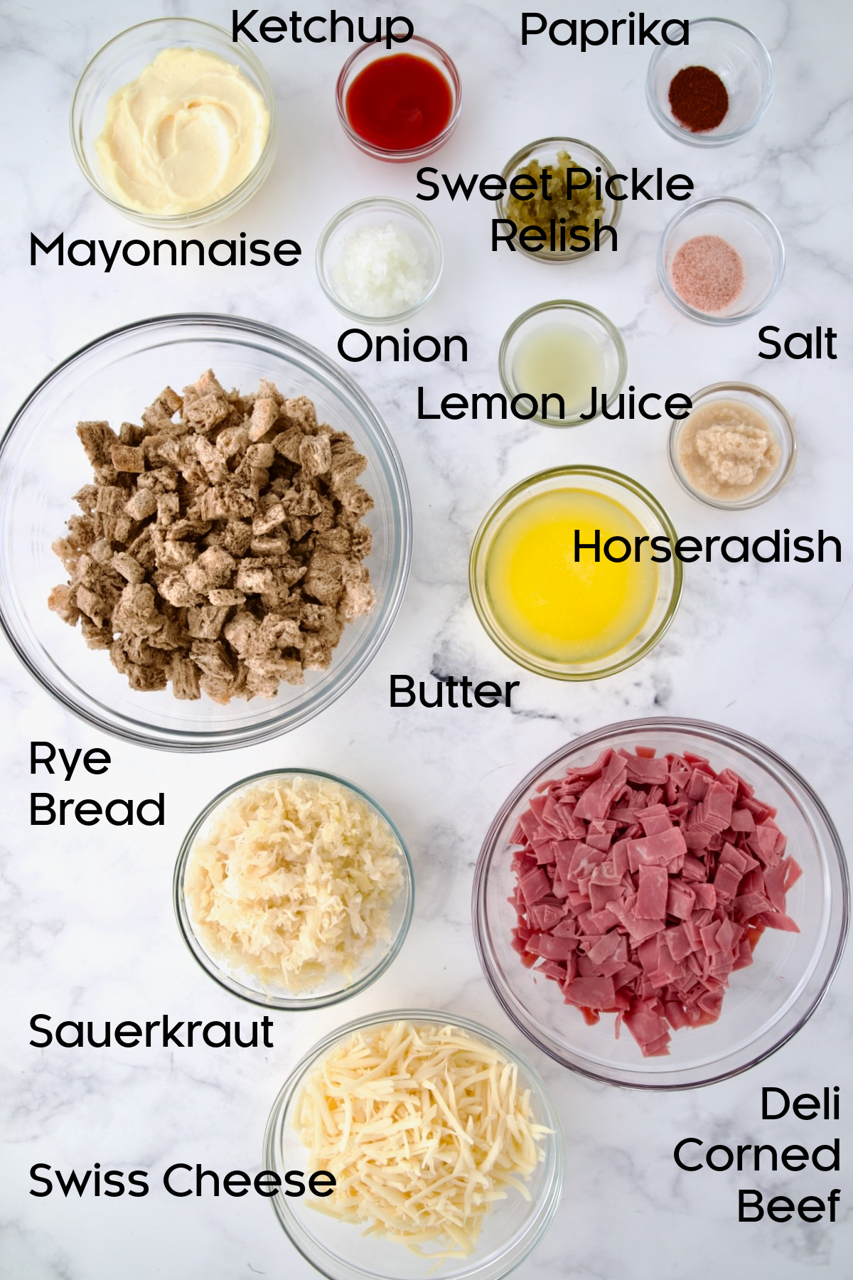 Ingredients for Reuben Casserole in glass bowls.
