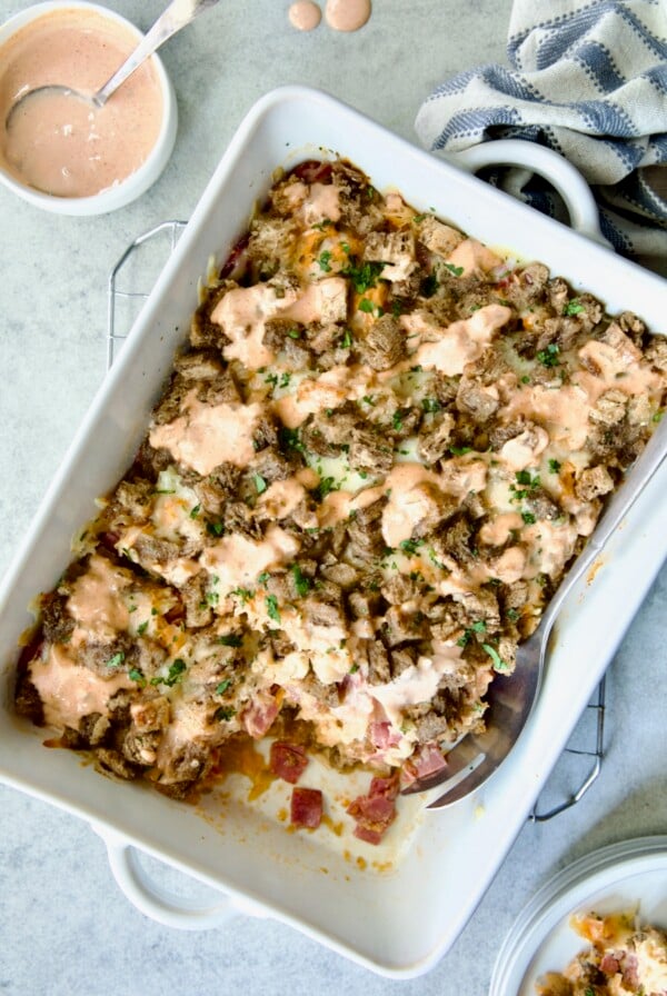 Reuben Casserole in white rectangular baking dish on cooling rack.