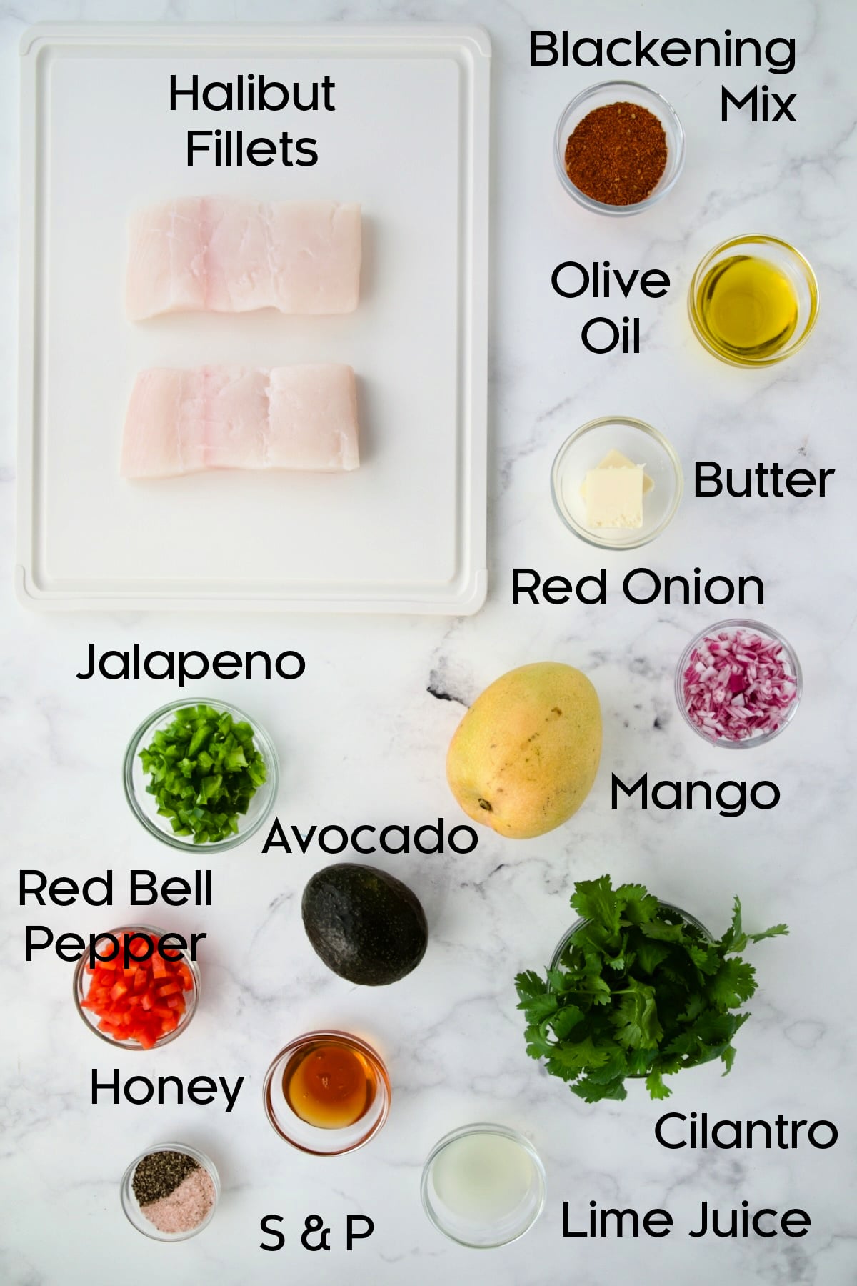 Ingredients for Blackened Halibut with Mango - Avocado Salsa in glass bowls with the fish on a white plastic cutting board.