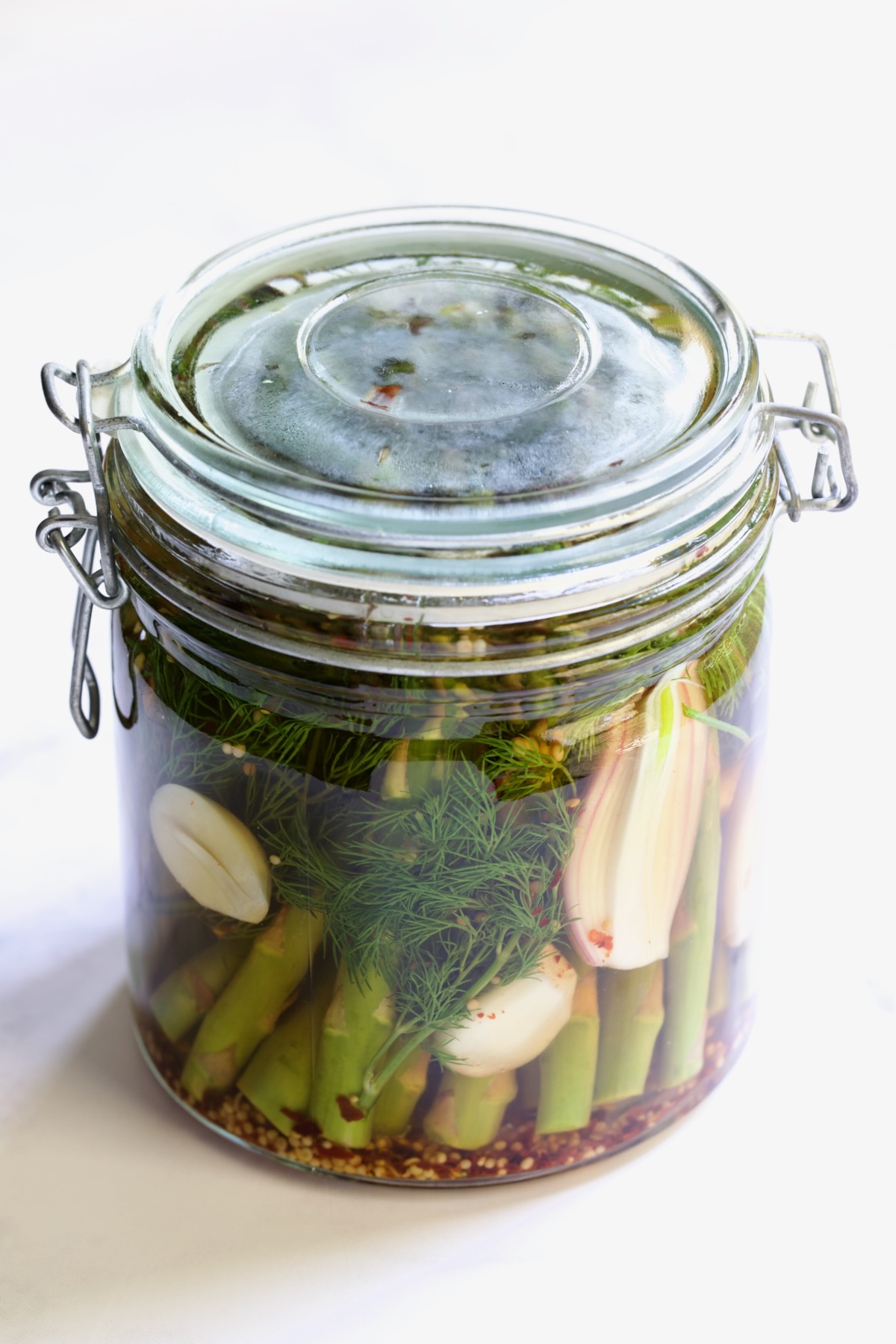 Asparagus in glass jar with top securely in place.