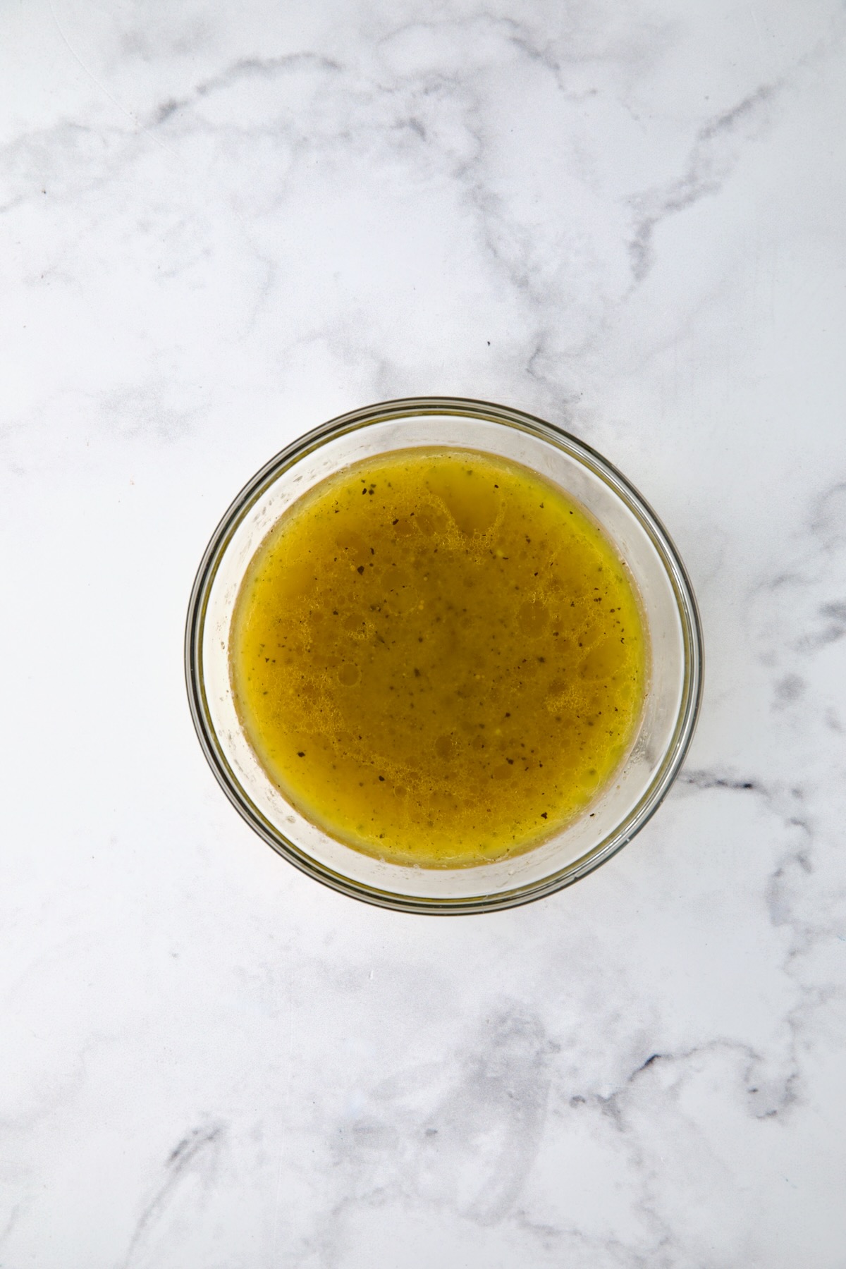 Vinaigrette for salad in glass bowl.