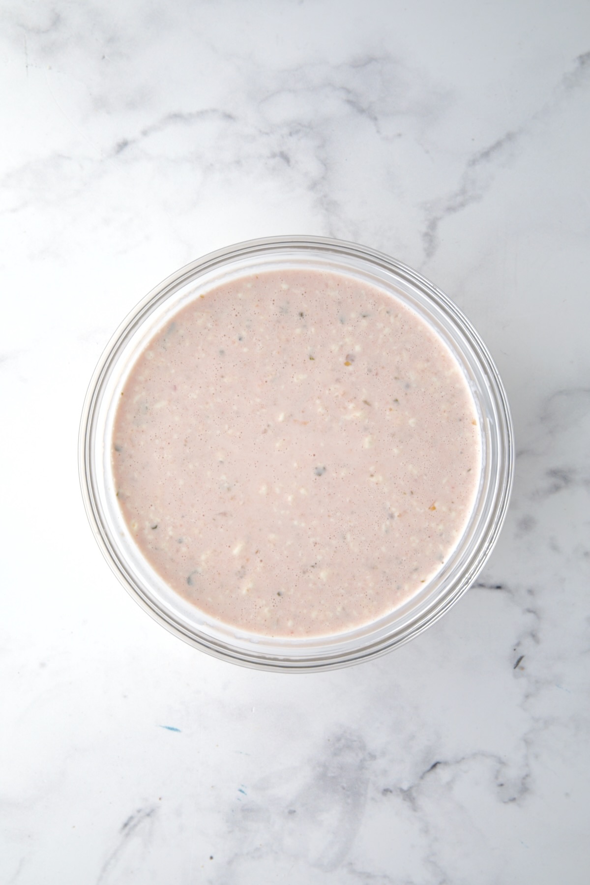 Salad dressing for Southwestern Layered Salad in glass bowl.