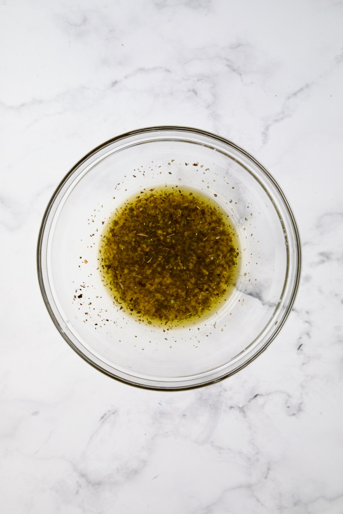 Marinade for Chicken Bruschetta in glass bowl.